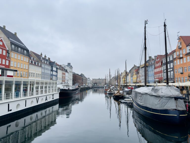 View of boats, canal, and canal houses at Nyhavn, Copenhagen