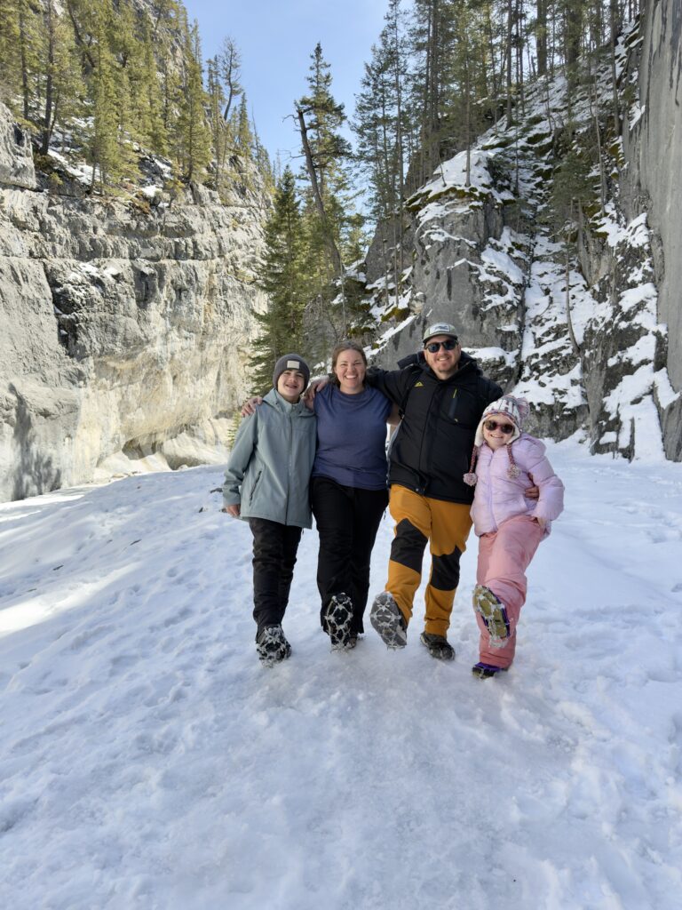 Family ice hiking in Grotto Canyon, Canmore, Canada